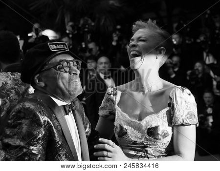  Spike Lee and Tonya Lewis Lee depart the screening of 'BlacKkKlansman' during the 71st annual Cannes Film Festival at Palais des Festivals on May 14, 2018 in Cannes, France. 