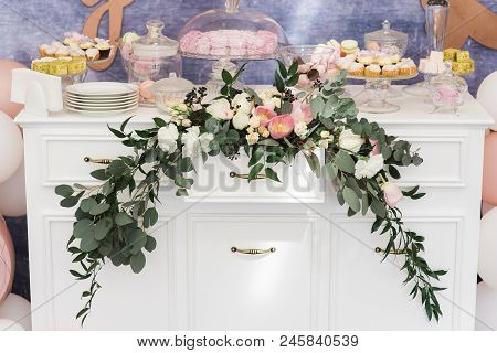 Beautiful Sweets On A Dresser. Stylish Candy Bar At A Modern Wedding. Candies, Pastries, Cakes Stand