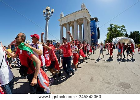 Football Fans Of The National Team Of Tunisia With National Flags And Attributes In Fanzone Fanfesta