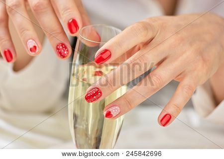 Woman Hand With Champagne Glass. Beautiful Female Manicured Hands And Crystal Glass Of Champagne. Co