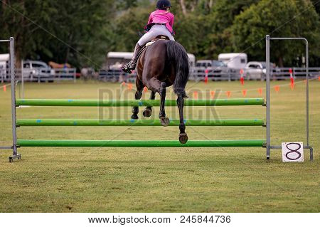A Rider And Horse Show Jumping In The Ring Events At A Country Show