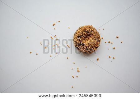 Single Ground Peanut Coated On Chocolate Flour Donut Isolated On White Background.