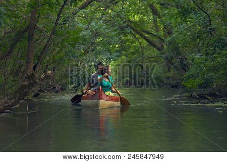 Canoeing in the water passages of Lake Tisza