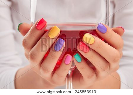 Big Glass Of Wine In Manicured Hands. Young Woman Hands With Trendy Summer Manicure Holding Glass Of