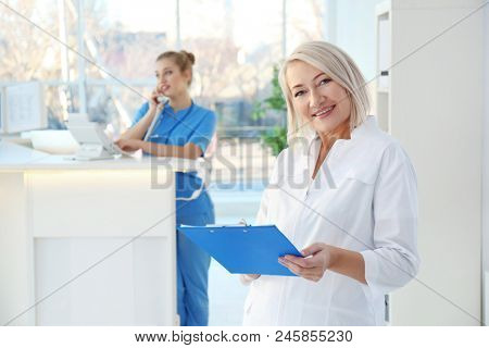 Female receptionist and trainee in hospital