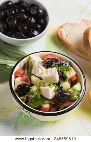Greek salad with feta cheese cubes and fresk vegetables
