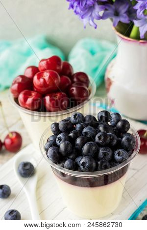 Italian Dessert Pana Cota With Berry Jam And Fresh Blueberries