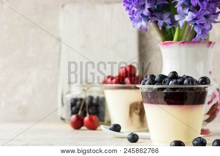 Italian Dessert Pana Cota With Berry Jam And Fresh Blueberries