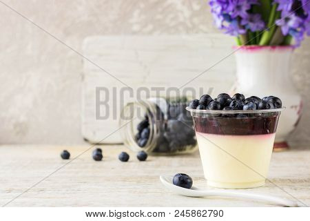 Italian Dessert Pana Cota With Berry Jam And Fresh Blueberries