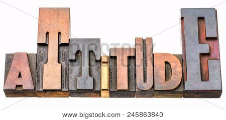attitude - isolated word abstract in vintage letterpress wood type printing blocks stained by color inks