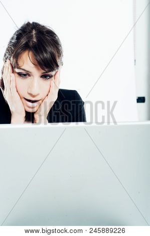 Young Caucasian Brunette Suit Dressed Business Woman Getting Surprised Working With Her Laptop Compu