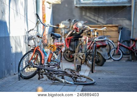 Beijing, China - March 10, 2016: Bicycles, Scooters And Cars In Beijing Streets. There Are Many Diff