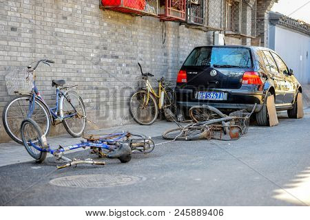 Beijing, China - March 10, 2016: Bicycles, Scooters And Cars In Beijing Streets. There Are Many Diff