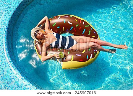 Young Woman On Summer Pool Party In Swimming Pool Drinkig Lemonade