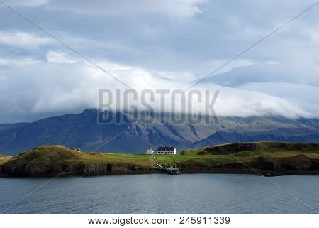 Beauty Of Wild Nature. Mountain Coast And Sea Under Cloudy Sky In Rejkjavik, Iceland. Mountain Lands