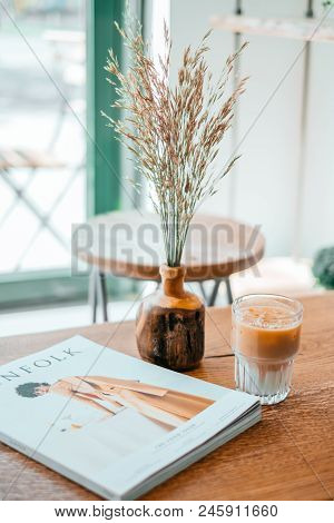 Kyiv, Ukraine - April 29, 2018: Breakfast In The Cafe. Cup Of Beautiful Cold Ice Latte With Fashion 