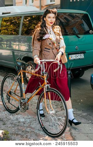 Kiev, Ukraine - May 12, 2018: Girl In Tweed Clothes Participating In Bicycle Tweed Run Retro Cruise 