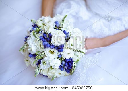 Beautiful Bride Is Holding A Wedding Colorful Bouquet. Beauty Of Colored Flowers. Close-up Bunch Of 