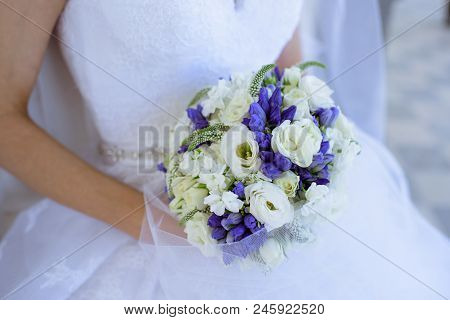 Beautiful Bride Is Holding A Wedding Colorful Bouquet. Beauty Of Colored Flowers. Close-up Bunch Of 