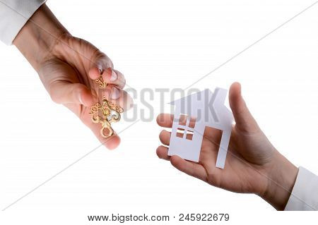 Hand Holding An Isolated Paper House With A White Background