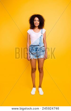 Full Body Shot Of Pretty Charming Girl In White T-shirt Jeans Jumpsuit With Slim Legs Looking At Cam
