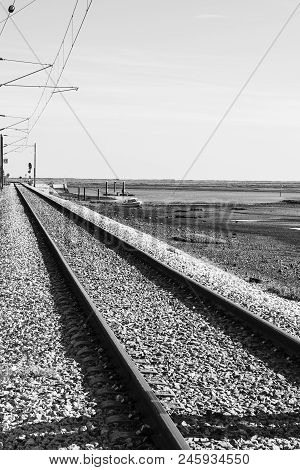 Railroad On The Shore Of Atlantic Ocean In Portugal. Electrified Railway Near Nature Park Of Ria For