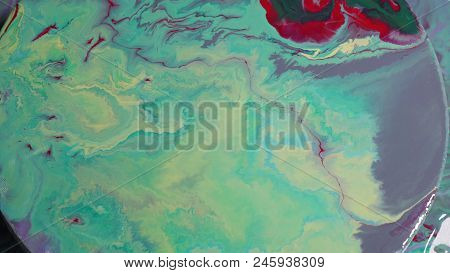Painted Round Canvas In Green In Fluid Art Style