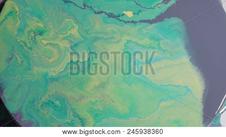 Painted Round Canvas In Green In Fluid Art Style
