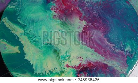 Painted Round Canvas In Green In Fluid Art Style