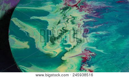Painted Round Canvas In Green In Fluid Art Style