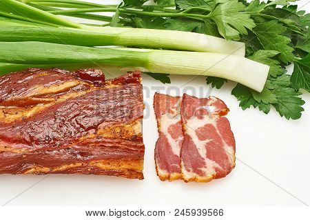 Pieces Of Pork Balyk With Fresh Green Lettuce On The White