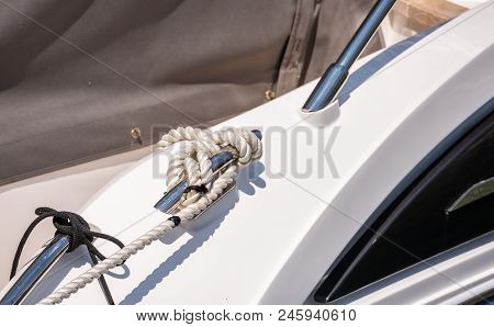 Dock Cleat On The Side Of A Boat In A Small Marina, An Element Of Yachting Equipment