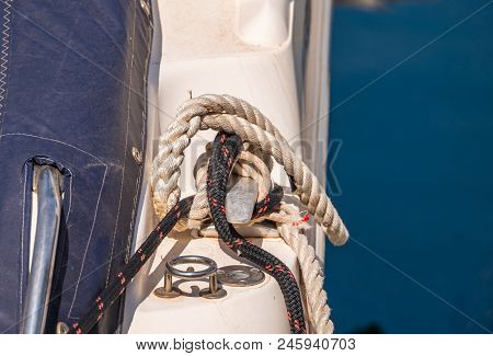 Dock Cleat On The Side Of A Boat In A Small Marina, An Element Of Yachting Equipment