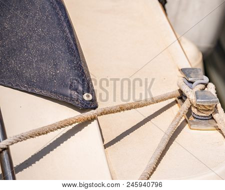 Dock Cleat On The Side Of A Boat In A Small Marina, An Element Of Yachting Equipment