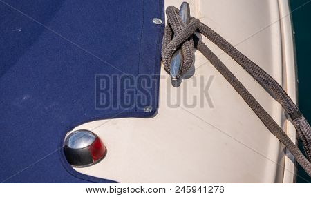 Dock Cleat On The Side Of A Boat In A Small Marina, An Element Of Yachting Equipment