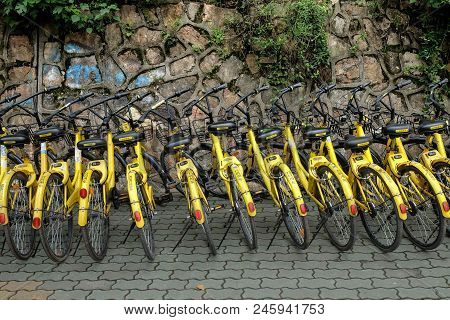 Wuhan, Hubei China - May 20, 2018: Row Of Yellow Bicycles ,ofo Free Sloating Bicycle Rental In China