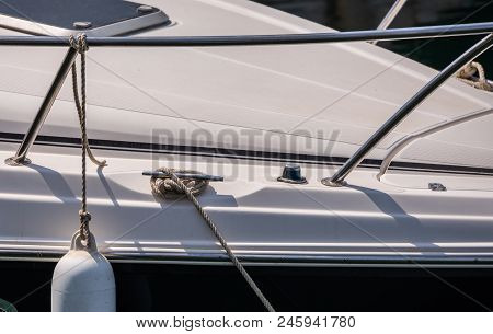 Dock Cleat On The Side Of A Boat In A Small Marina, An Element Of Yachting Equipment