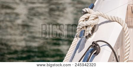 Dock Cleat On The Side Of A Boat In A Small Marina, An Element Of Yachting Equipment