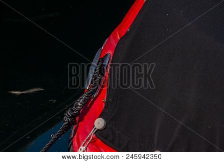 Dock Cleat On The Side Of A Boat In A Small Marina, An Element Of Yachting Equipment