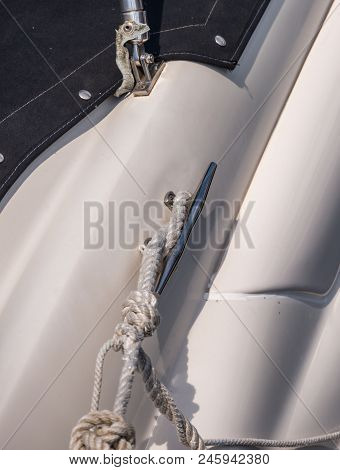 Dock Cleat On The Side Of A Boat In A Small Marina, An Element Of Yachting Equipment
