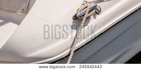 Dock Cleat On The Side Of A Boat In A Small Marina, An Element Of Yachting Equipment