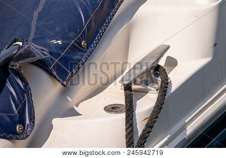 Dock Cleat On The Side Of A Boat In A Small Marina, An Element Of Yachting Equipment