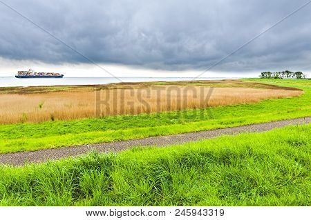 Big Ship Navigating In North Sea In Holland. Containership Is Heading For The North Sea.