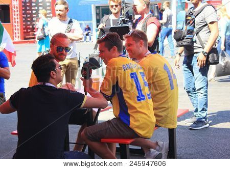 St. Petersburg, Russia - June 18, 2018: Journalist Interviewing Fans From Sweden At Fifa World Cup O