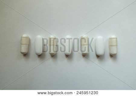 Tablets Of Calcium Citrate And Capsules Of Magnesium Citrate In A Row