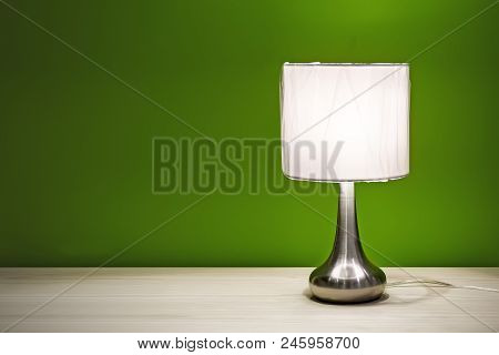 Bedside Lamp Isolated On The Table For Interior Use. Night Lamp With Round Shade Standing On A Woode