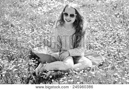 Child Posing With Sunglasses Cardboard Smiling Lips For Photo Session At Meadow. Girl Sits On Grass 