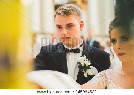 Wedding Couple Bide And Groom Get Married In A Church.