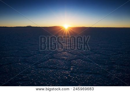 Salar de Uyuni at sunrise. Salt flat of the Salar de Uyuni during sunrise, Bolivia