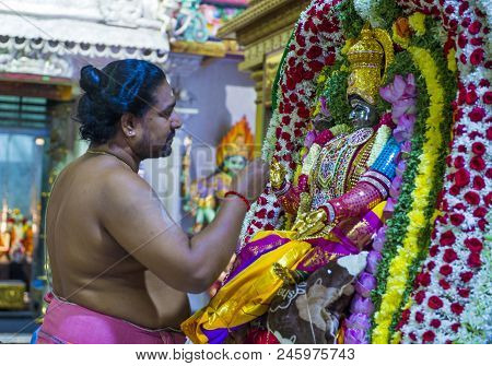 Singapore - Feb 24 : Indian Man Decorating Idol In Sri Veeramakaliamman Temple In Little India, Sing